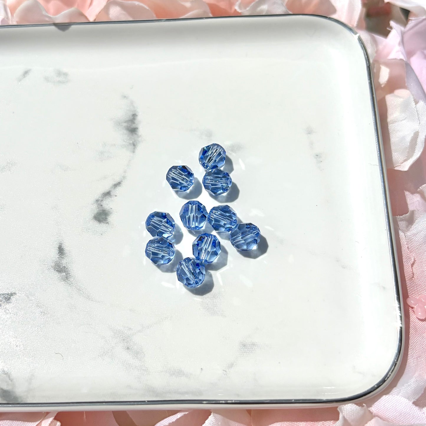8MM - SWAROVSKI FACETED ROUND - LIGHT SAPPHIRE